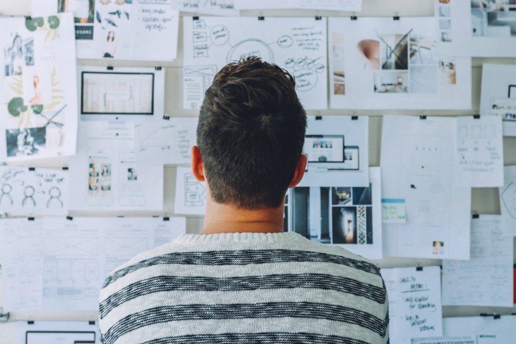 Man looking at pros and cons for LinkedIn Sales Navigator